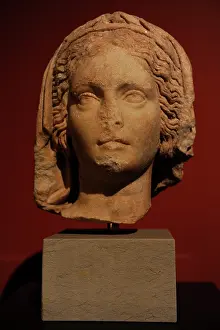 Olive: Robed head of a priestess of the goddess Athena. Pergamon