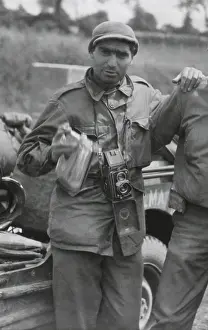 Capa: Robert Capa, in France while on assignment photographing