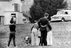 Hickory: Robert Kennedy is comforted by two of his ?