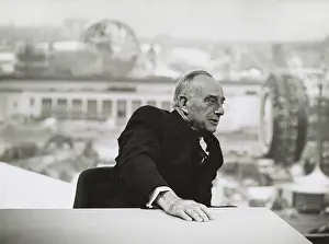 Modernization: Robert Moses in 1964, seated at a table with