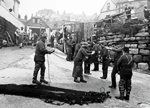 Hoods: Robin Hoods bay repairing the nets