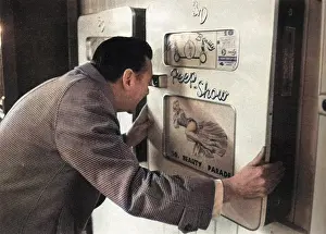 Voyeurism: Robin Maugham looking at a peep-show in Brighton