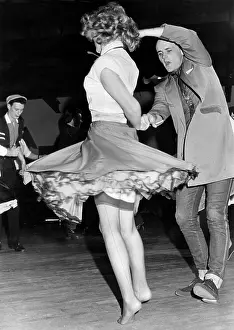 Rock and roll dancing couple