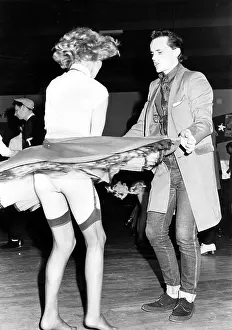 Rock and roll dancing couple