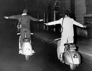 Singular: Roman paparazzi stand on vespas