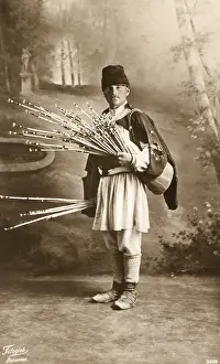 Tapers: Romanian man with bunch of thin sticks