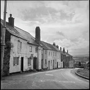 Tamar: A row of cottages stepping down a hill towards