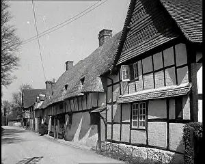 Timbered: A Row of Timbered Thatched Cottages in a Village