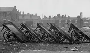 Wasteland: A row of upturned carts on waste ground