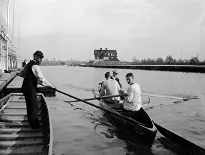 Scull: Rowers in a scull on a river