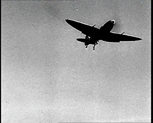 Dropping: Royal Air Force Spitfire Flying Over the English