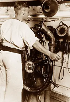 Helmsman: Royal Navy helmsman at the wheel