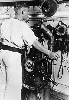 Helmsman: Royal Navy helmsman at the wheel probably 1930s