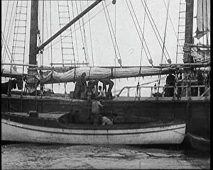 Runners: Rum Runners on a Boat Offloading Their Cargo