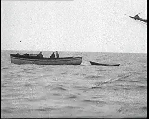 Runners: Rum Runners on a Boat Offloading Their Cargo
