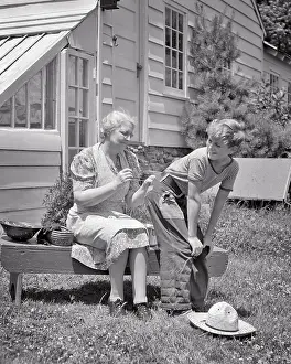 Grandsons: Rural Grandmother Sewing with Needle and Thread