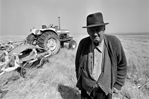 Oosterbroek: Rural scene - old white farmer with his tractor