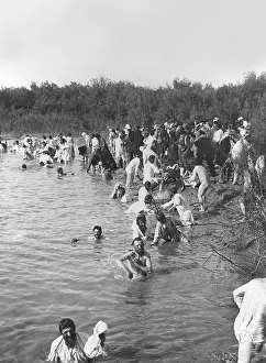 Pilgrims: Russian Orthodox pilgrims bathe at Easter in the Jordan, 190