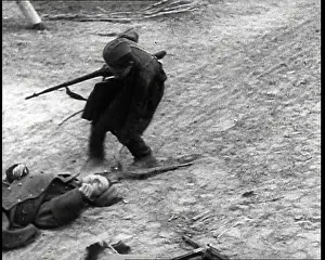Recovering: A Russian Partisan Recovering a Rifle From