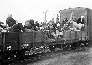 Deported: Russian refugees in an open wagon, 1942