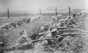 Alertness: Russian soldiers with guns in trenches during