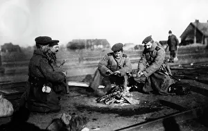 Campfire: Russian soldiers round a camp fire