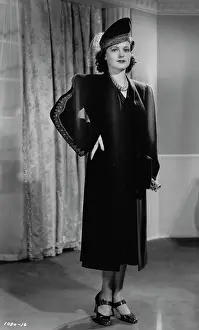 Housecoat: Ruth Hussey in Within the Law (1939)