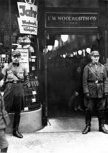 Encouraging: SA men stand guard outside a branch of Woolworth