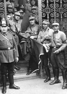 Ripped: SA stormtroopers stand on the steps of the occupied Neukoell