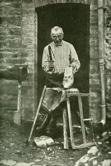 Sabots: Sabot maker working at his cottage door, Belgium