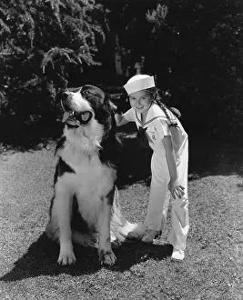 Everett Collection (old Visuals): Sailor girl and St. Bernard