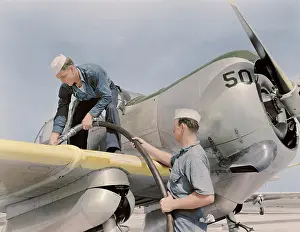 Cone: Sailor mechanics refueling an SNC advanced