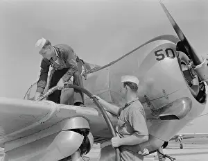 Propeller: Sailor mechanics refueling an SNC advanced