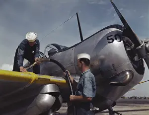Propeller: Sailor mechanics refueling an SNC advanced