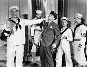 Confronting: Sailor punching a policeman