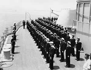 Conformity: Sailors at attention on naval ship