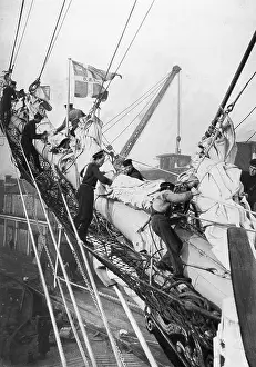 Bowsprit: Sailors on the bowsprit of a Danish training ship, 1925