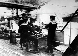 Adjust: Sailors at a cannon on a warship, 1914
