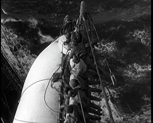 Washed: Sailors Hanging On To A Sail on a Large Sailing