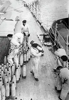 Cutter: Sailors stowing grenades, 1939