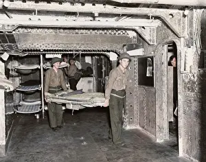 Removing: Sailors stripping ship aboard USS Ranger in
