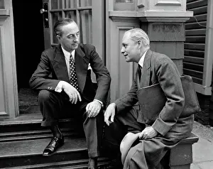 Stoop: Salesman and home owner man sitting together