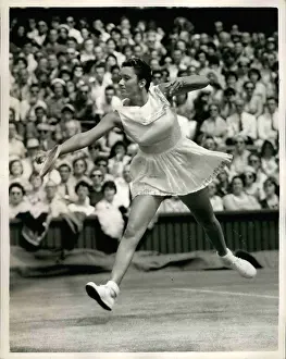 Versus: Sally Moore in tennis match at Wimbledon