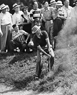 Snead: Sam Snead makes an iron shot from the side of a