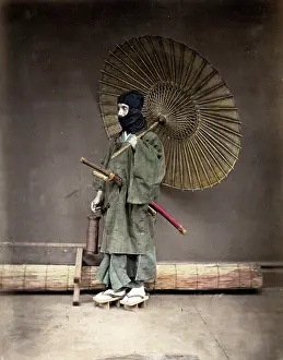Meiji: Samuari in winter clothes, and umbrella, Japan
