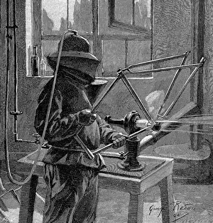 Operator: Sandblasting the joints of a bicycle frame; operator