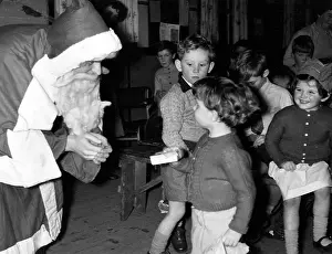 Intently: SANTA HANDS OUT PRESENTS