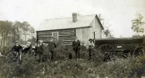 Buggy: Saskatchewan River bridge - Group of men, log cabin