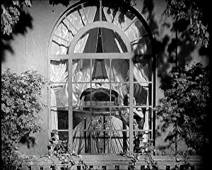 Slowly: Scene from a 1920s Film. The Curtains of An