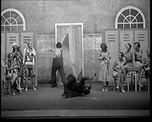 Swimsuits: Scene From a Stage Show: Two Male Actors Falling